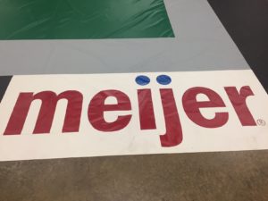 meijer logo painted on tarp