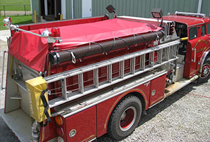 Fire truck with tarp draped over the top
