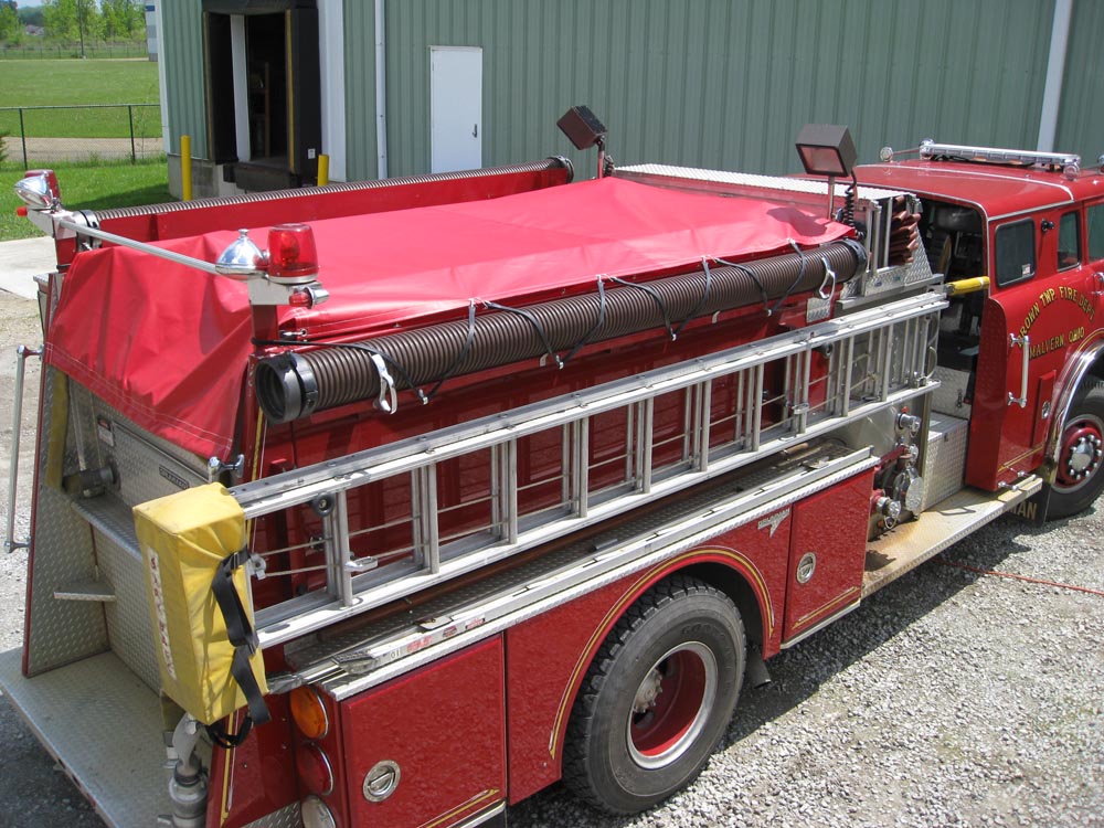 fire engine with red tarp