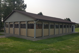 Enclosure tarp with clear and solid panels