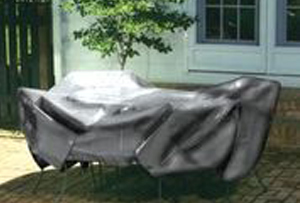 Sunshield tarp covering patio furniture