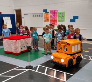 children gathered on a safety town tarp