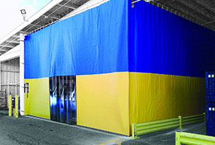 Custom divider tarp with blue on top, yellow on the bottom, and a doorway